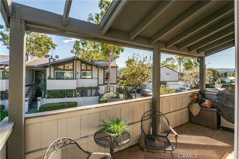 a room with a large window and furniture