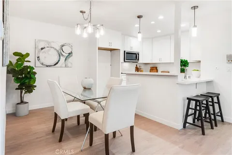 a view of kitchen with furniture and a potted plant