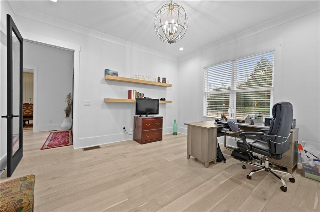 2550 Kilgore Road Buford, GA 30519 - Photo 11 of 64 a view of a workspace with furniture and a window