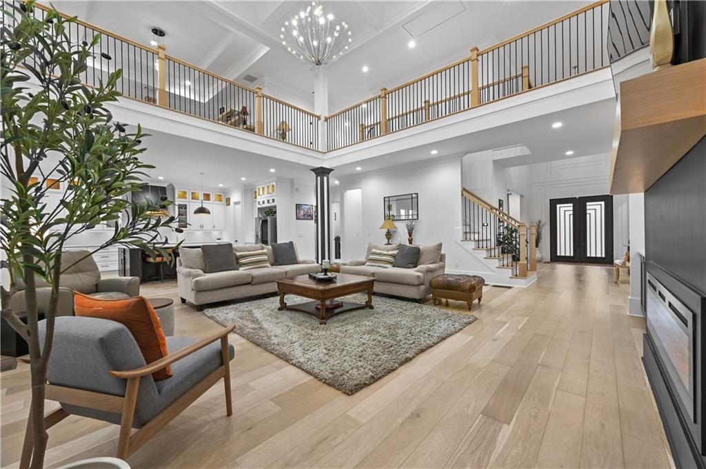 2550 Kilgore Road Buford, GA 30519 - Photo 13 of 64 a living room with furniture and a chandelier
