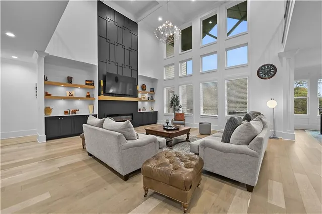 a kitchen with stainless steel appliances granite countertop a sink and a refrigerator