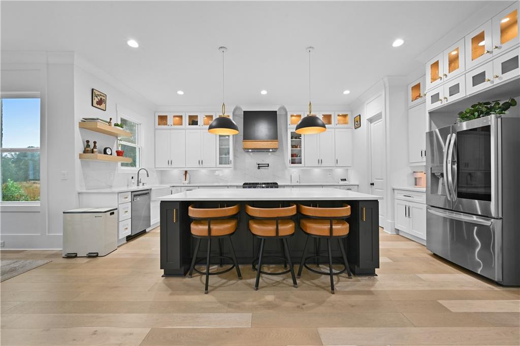 2550 Kilgore Road Buford, GA 30519 - Photo 17 of 64 a kitchen with stainless steel appliances granite countertop a sink and a refrigerator