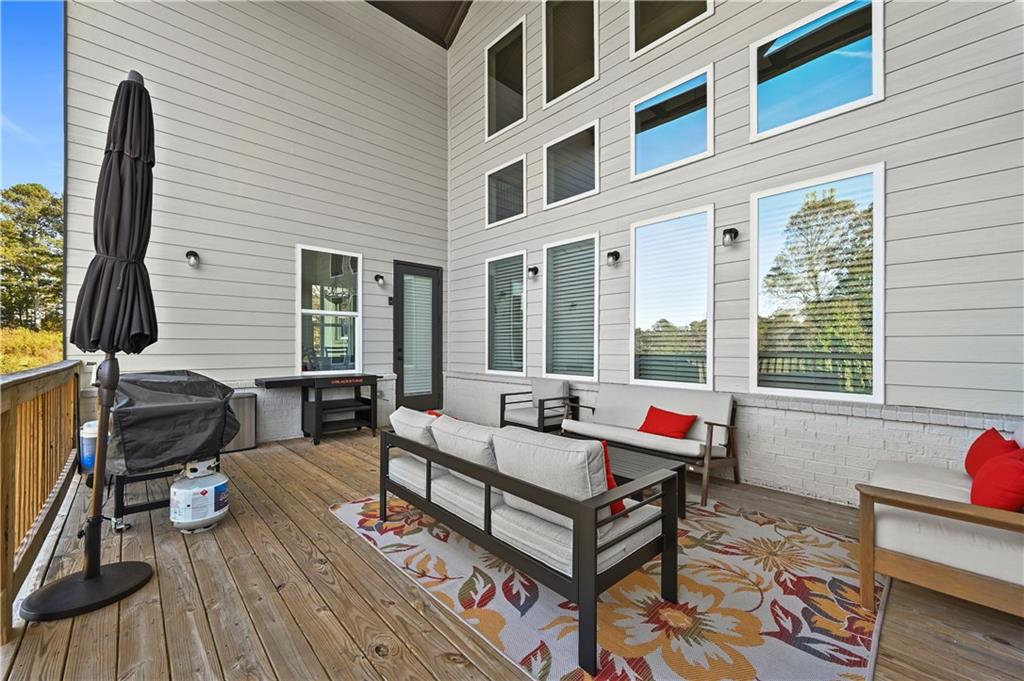 2550 Kilgore Road Buford, GA 30519 - Photo 23 of 64 a living room with furniture fireplace and flat screen tv