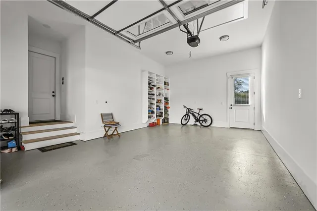 a bedroom with a bed couch and a large window