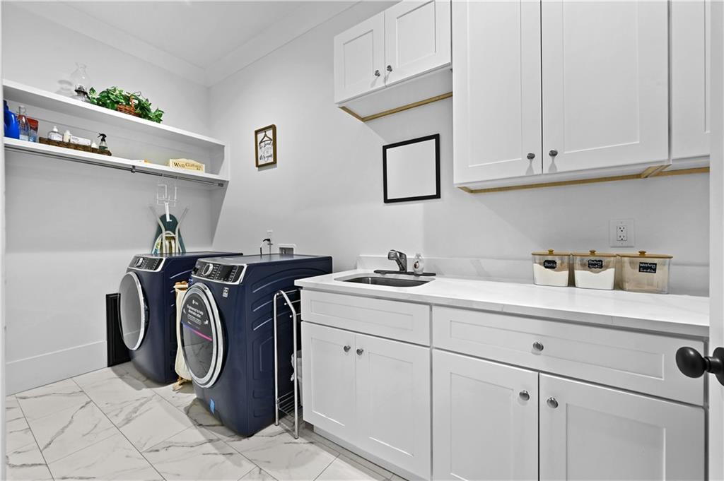2550 Kilgore Road Buford, GA 30519 - Photo 28 of 64 a utility room with cabinets