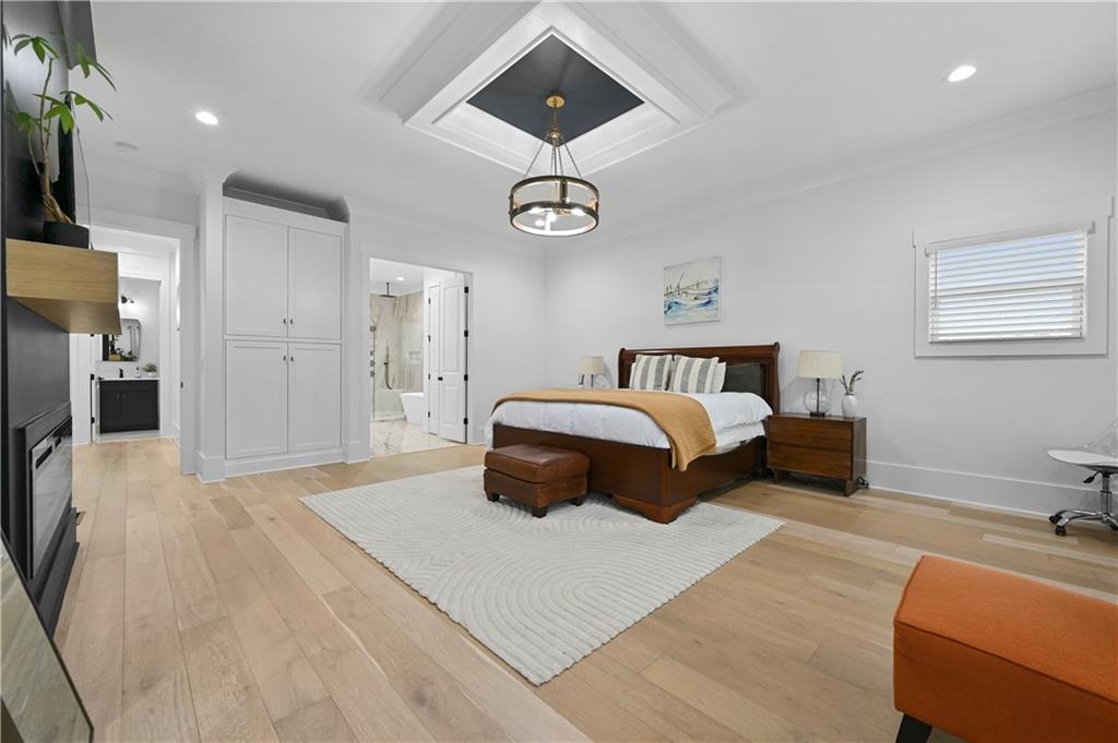 2550 Kilgore Road Buford, GA 30519 - Photo 30 of 64 a bedroom with a bed and a chandelier