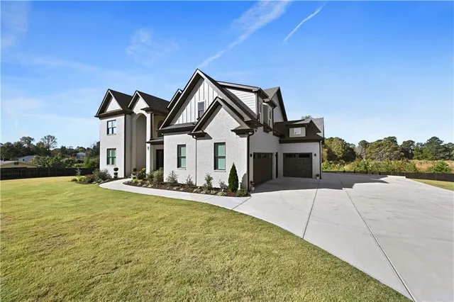 a front view of a house with yard
