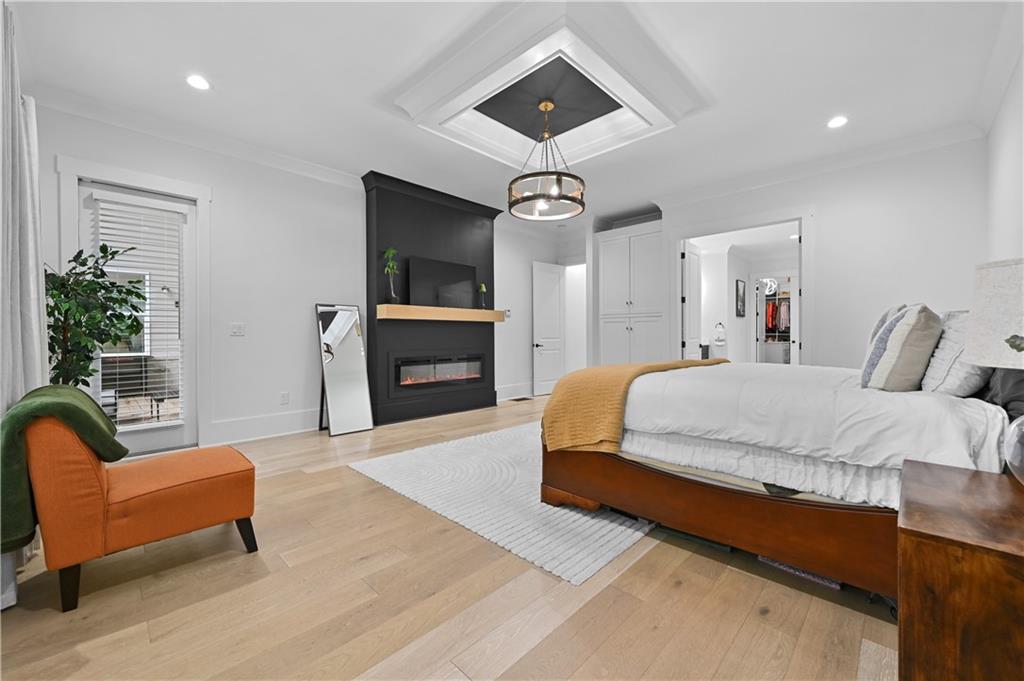 2550 Kilgore Road Buford, GA 30519 - Photo 31 of 64 a spacious bedroom with a bed a couch and dresser