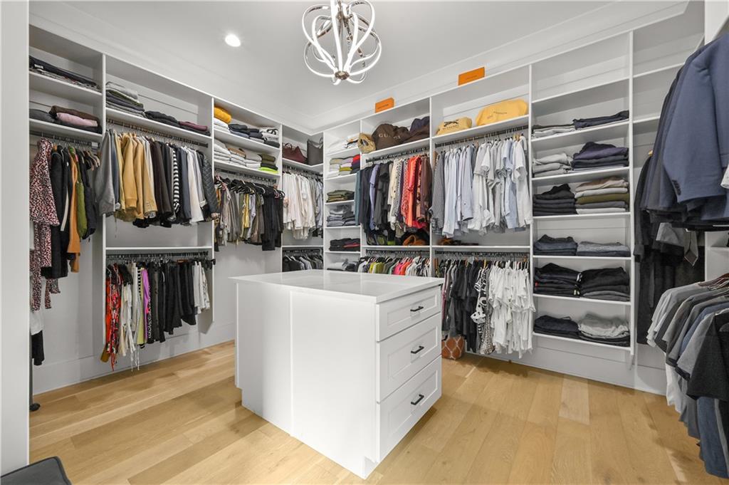 2550 Kilgore Road Buford, GA 30519 - Photo 35 of 64 a view of walk in closet with clothes and shoes