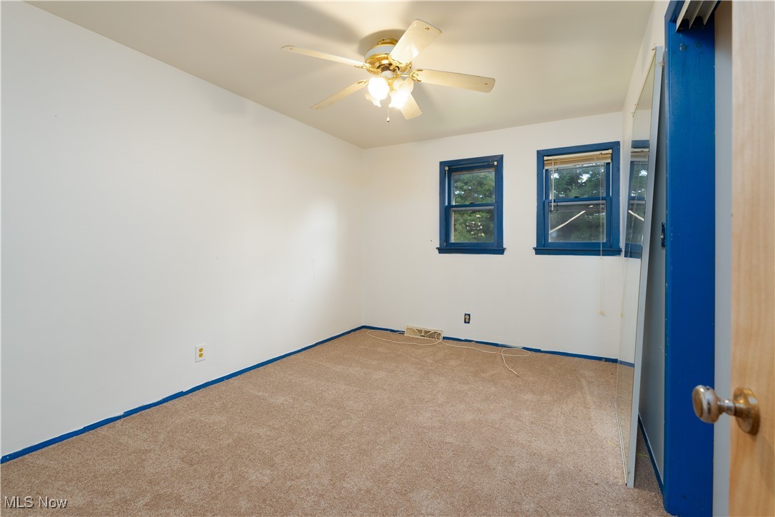 4491 Fox Road Kingsville, OH 44048 - Photo 25 of 33 Unfurnished room featuring ceiling fan and carpet flooring