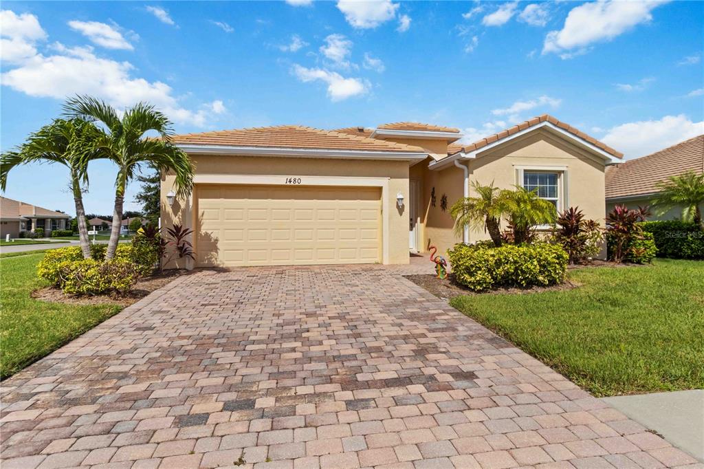 1480 Mossy Oak Drive North Port, FL 34287 - Photo 1 of 39 a front view of house with a yard and potted plants