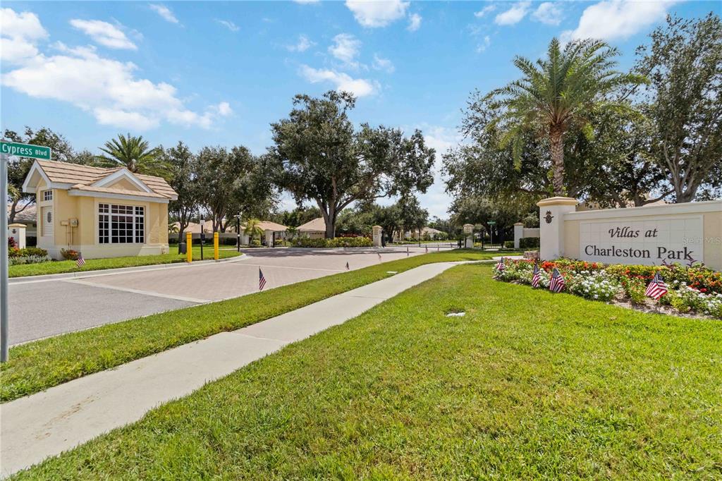 1480 Mossy Oak Drive North Port, FL 34287 - Photo 11 of 39 a view of a house with a big yard and potted plants