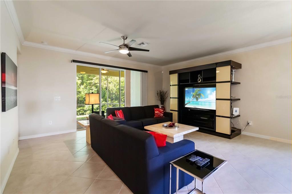 1480 Mossy Oak Drive North Port, FL 34287 - Photo 14 of 39 a living room with furniture and a flat screen tv