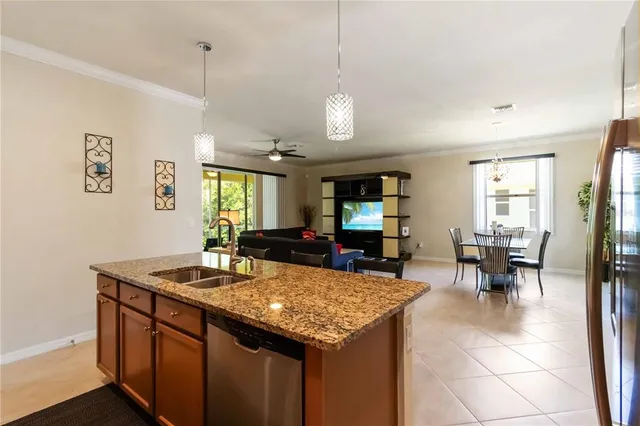 a kitchen with stainless steel appliances sink a microwave and cabinets