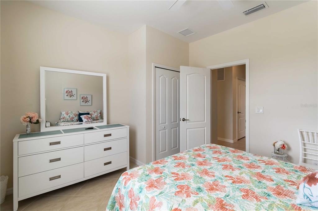 1480 Mossy Oak Drive North Port, FL 34287 - Photo 23 of 39 a bedroom with a bed and a dresser