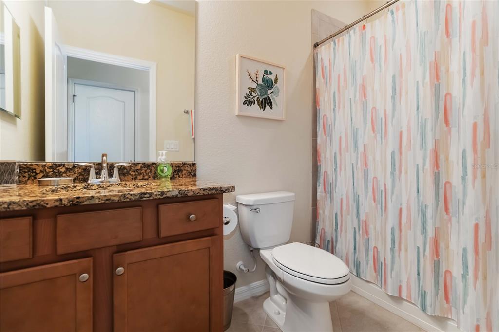 1480 Mossy Oak Drive North Port, FL 34287 - Photo 24 of 39 a bathroom with a toilet sink and mirror