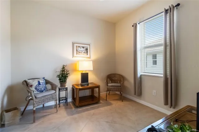 a bathroom with a granite countertop toilet sink and mirror