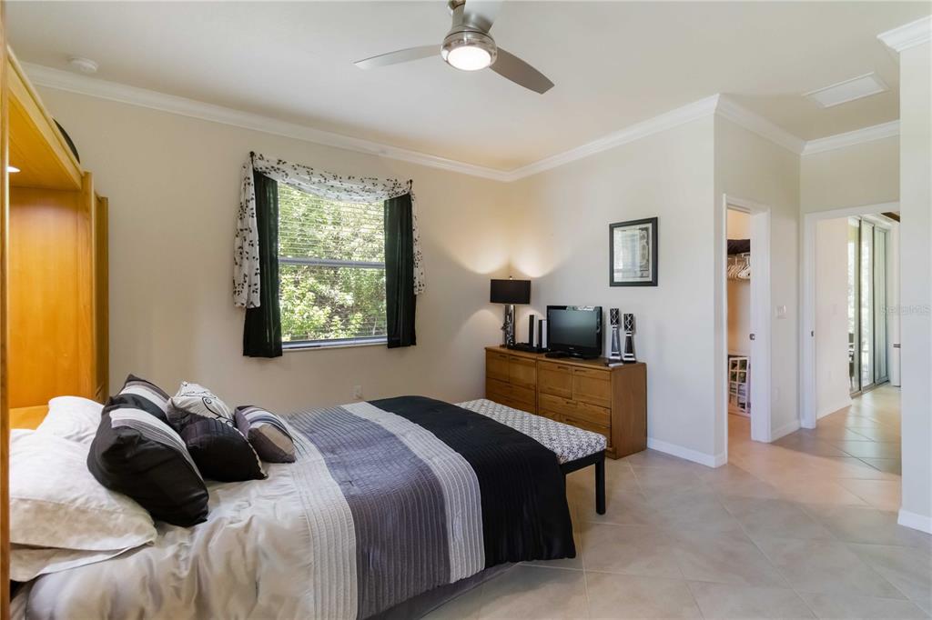 1480 Mossy Oak Drive North Port, FL 34287 - Photo 32 of 39 a bedroom with a bed and window