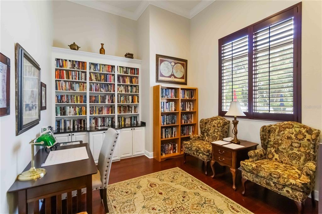 1480 Mossy Oak Drive North Port, FL 34287 - Photo 36 of 39 a living room with furniture and a book shelf