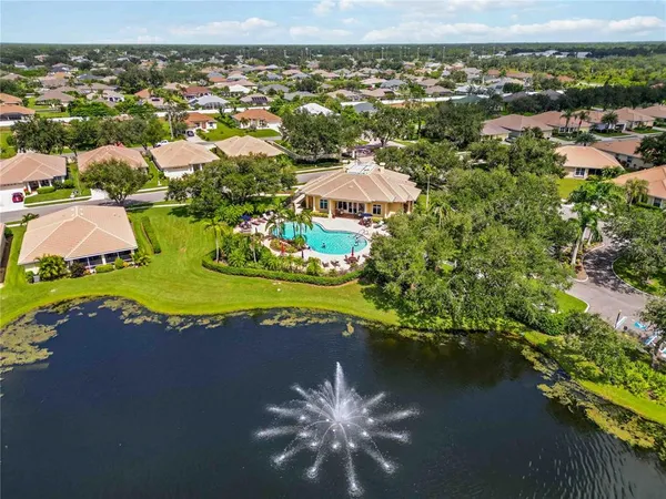 an aerial view of a house with a lake view
