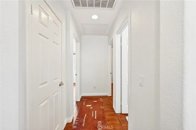 a view of a room that has a bed and a window