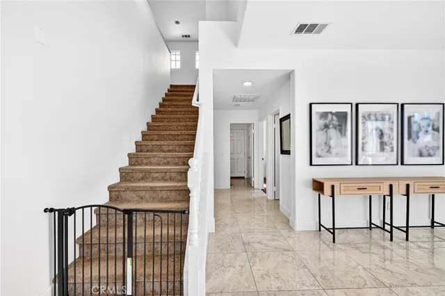 a bathroom with a double vanity sink mirror and shower