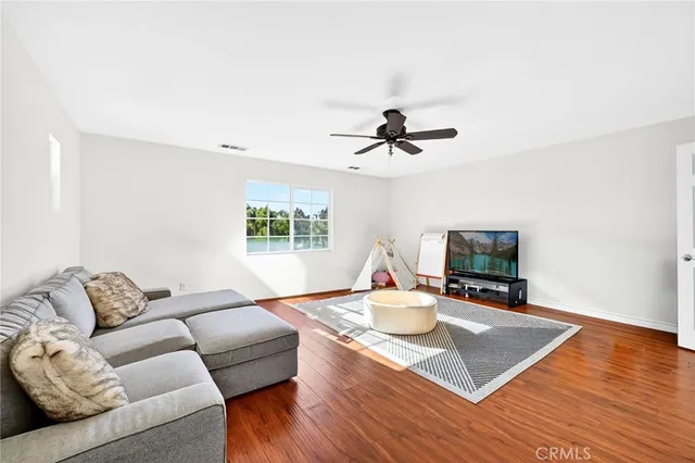 a room with furniture and wooden floor