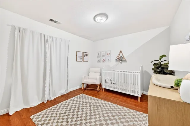 a bedroom with a bed and a chair