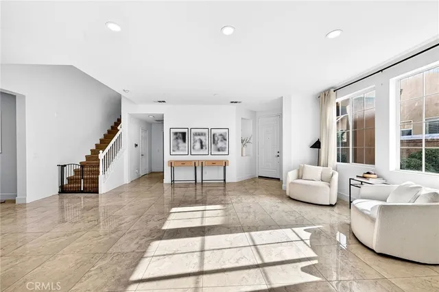 a living room with fireplace furniture and a flat screen tv