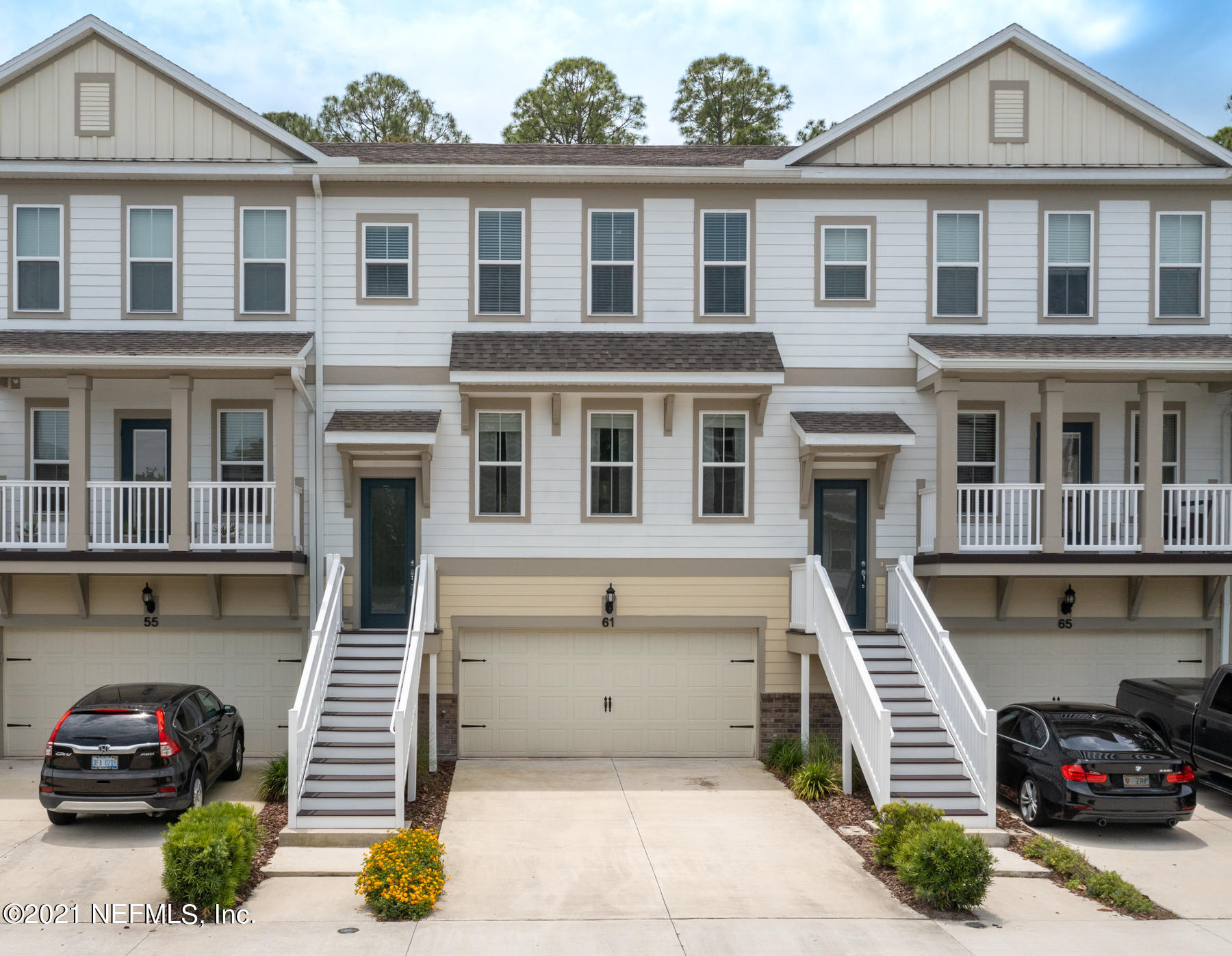 61 Spring Tide Way Ponte Vedra, FL 32081 - Photo 1 of 56 a front view of a house with a parking space