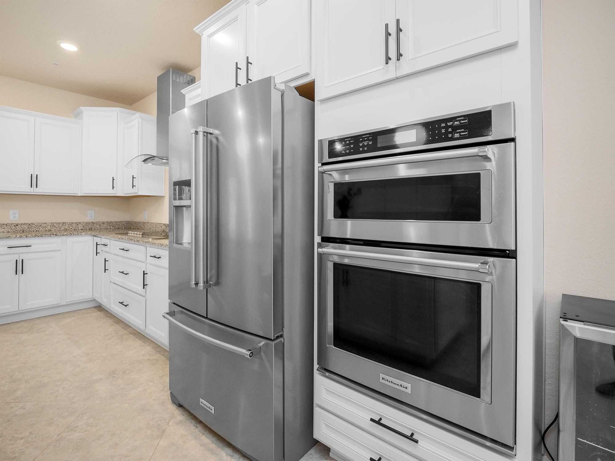 61 Spring Tide Way Ponte Vedra, FL 32081 - Photo 10 of 56 a kitchen with stainless steel appliances white cabinets a stove and a microwave