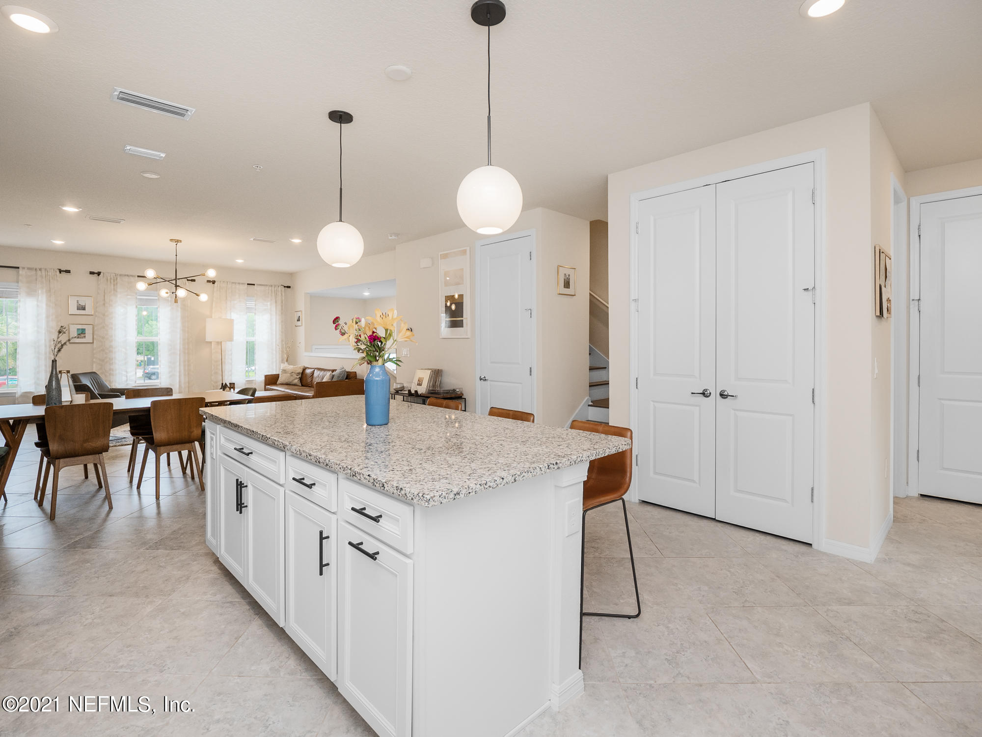 61 Spring Tide Way Ponte Vedra, FL 32081 - Photo 11 of 56 a kitchen with center island table and chairs