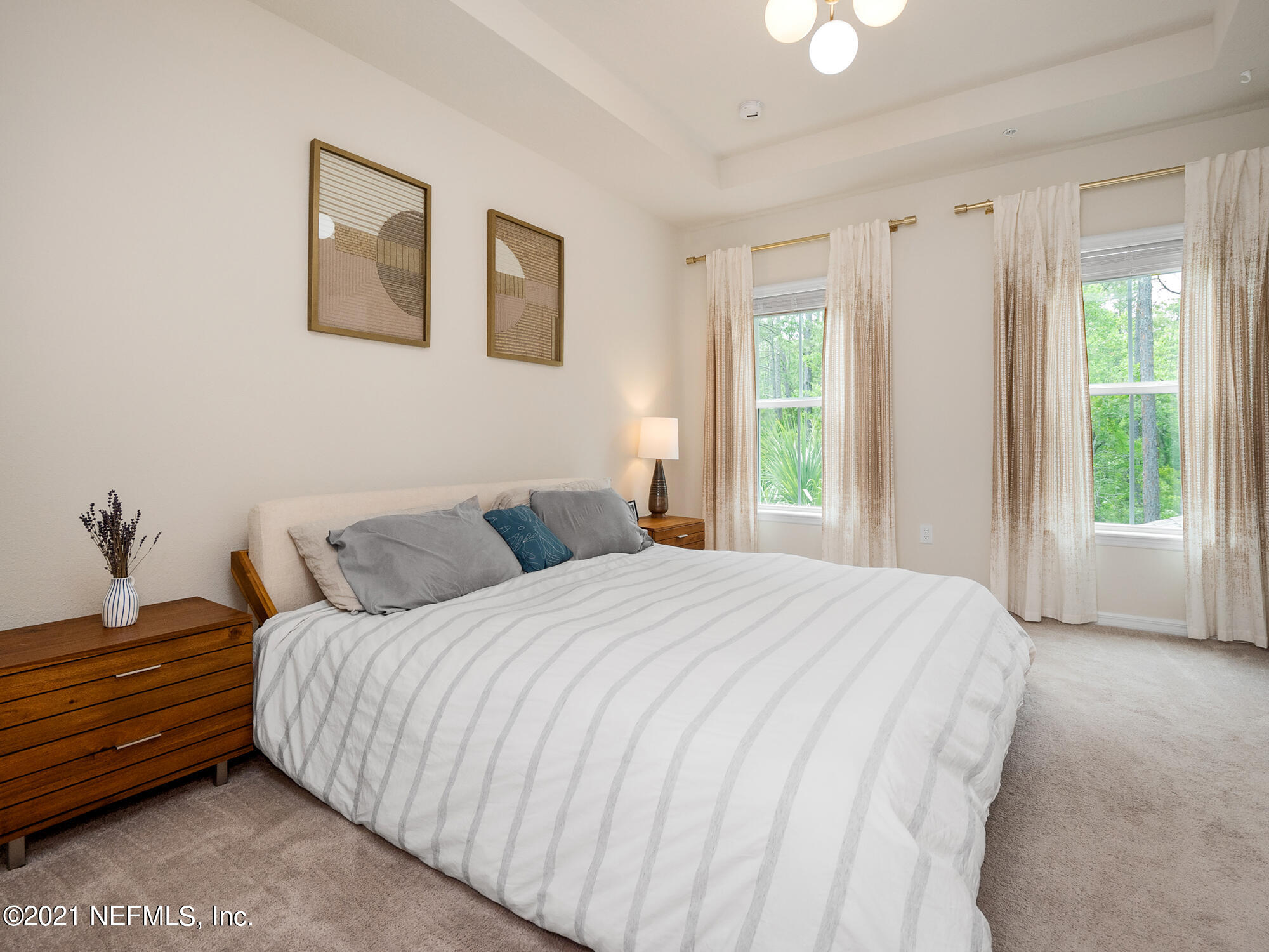 61 Spring Tide Way Ponte Vedra, FL 32081 - Photo 17 of 56 a bedroom with a bed and a window
