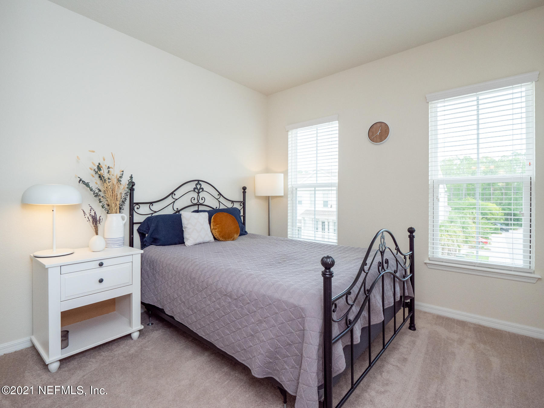 61 Spring Tide Way Ponte Vedra, FL 32081 - Photo 24 of 56 a bedroom with a bed and window