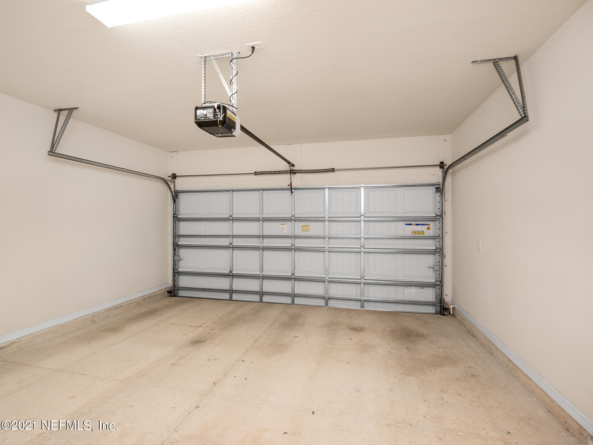 61 Spring Tide Way Ponte Vedra, FL 32081 - Photo 27 of 56 a view of a garage with racks on the wall