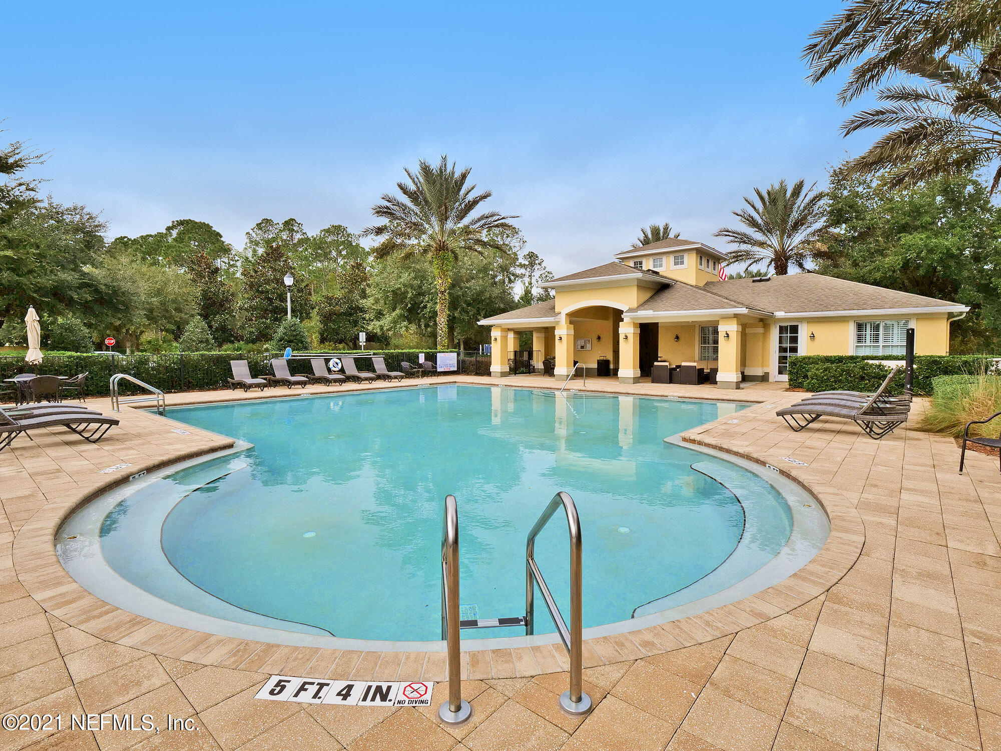 61 Spring Tide Way Ponte Vedra, FL 32081 - Photo 39 of 56 a view of a swimming pool and trees in the background