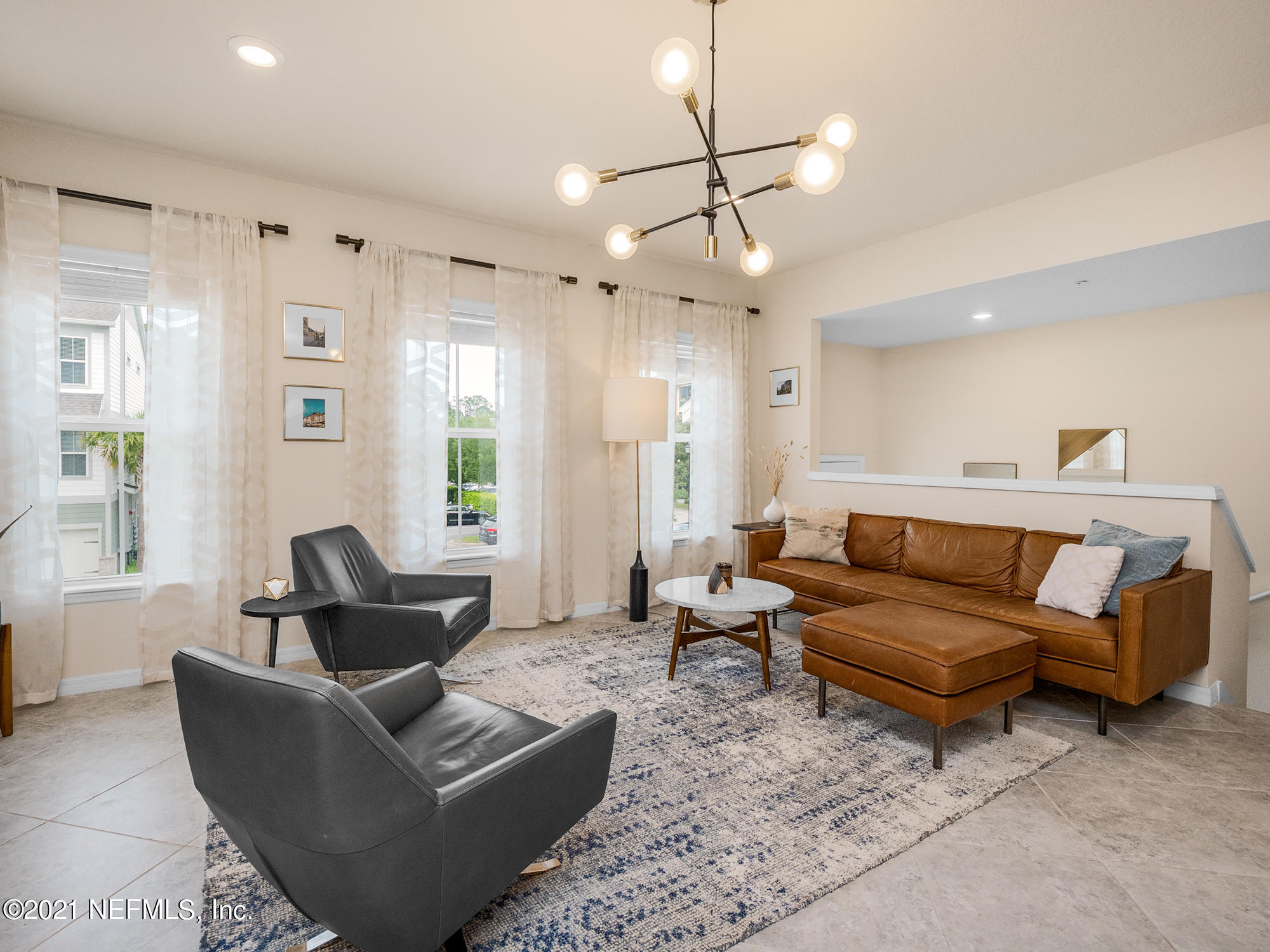 61 Spring Tide Way Ponte Vedra, FL 32081 - Photo 4 of 56 a living room with furniture potted plant and a window