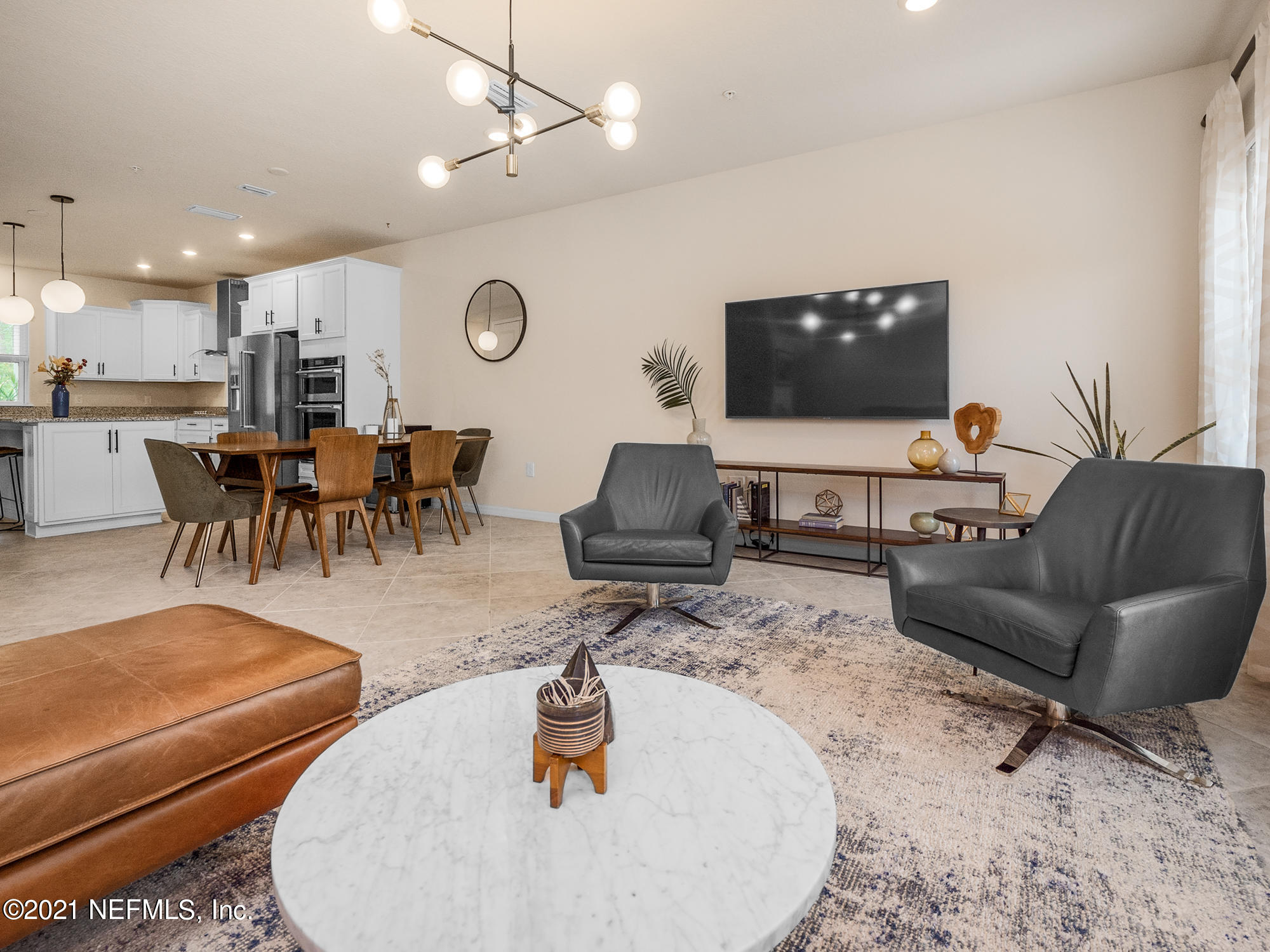 61 Spring Tide Way Ponte Vedra, FL 32081 - Photo 56 of 56 a living room with furniture and a flat screen tv