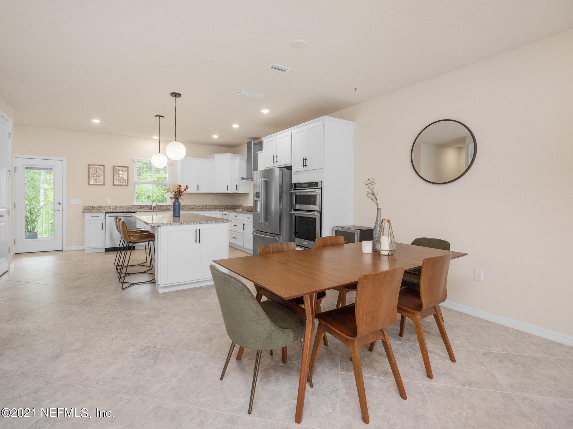 61 Spring Tide Way Ponte Vedra, FL 32081 - Photo 5 of 56 a view of a dining room with furniture and a kitchen