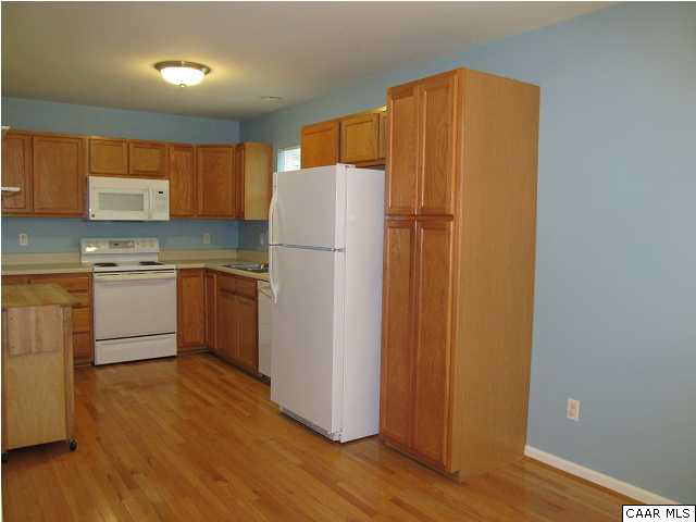 3 Highland Road Palmyra, VA 22963 - Photo 5 of 25 a kitchen with a refrigerator sink and cabinets