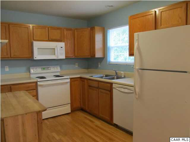 3 Highland Road Palmyra, VA 22963 - Photo 6 of 25 a kitchen with a refrigerator sink and cabinets