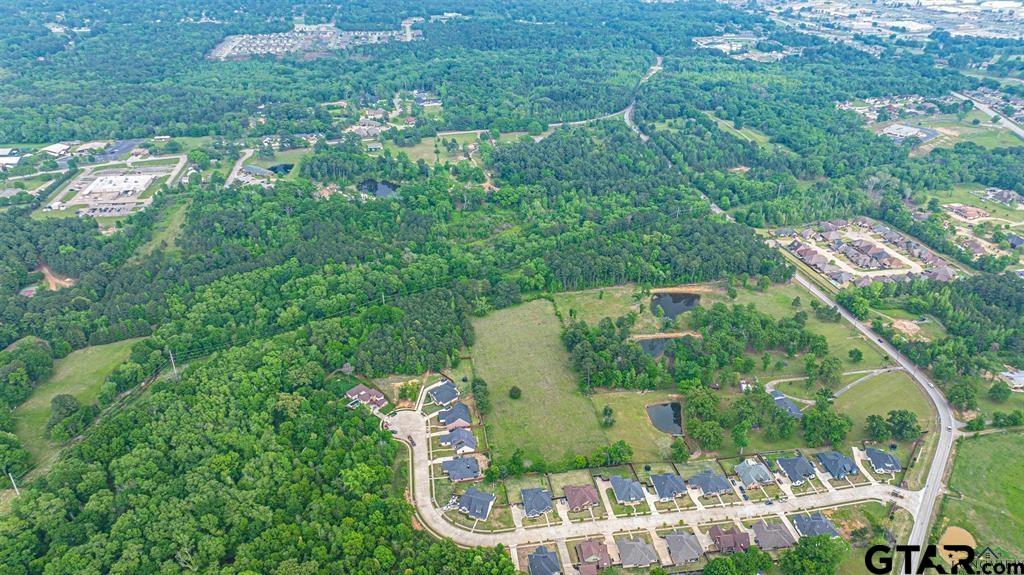 4119 McCann Road Longview, TX 75605 - Photo 11 of 16 an aerial view of a house with a yard and outdoor seating