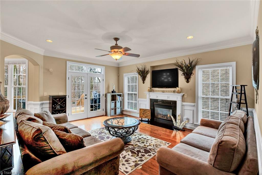 338 Homestead Avenue High Point, NC 27262 - Photo 11 of 25 large living room with gas fireplace and double doors that open up to new deck