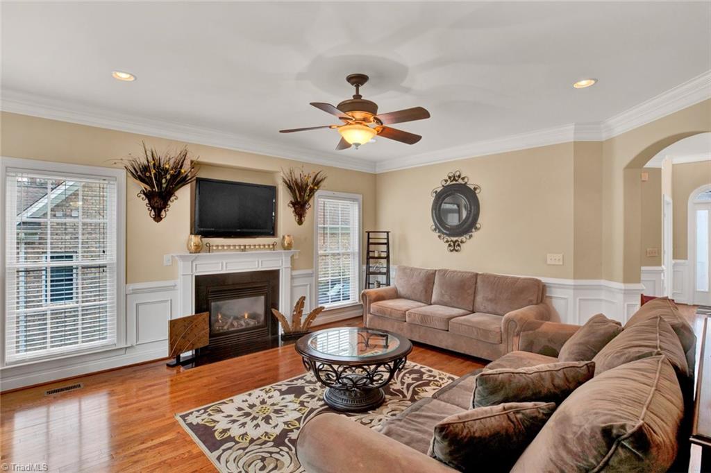 338 Homestead Avenue High Point, NC 27262 - Photo 12 of 25 large living room with gas fireplace and double doors that open up to new deck