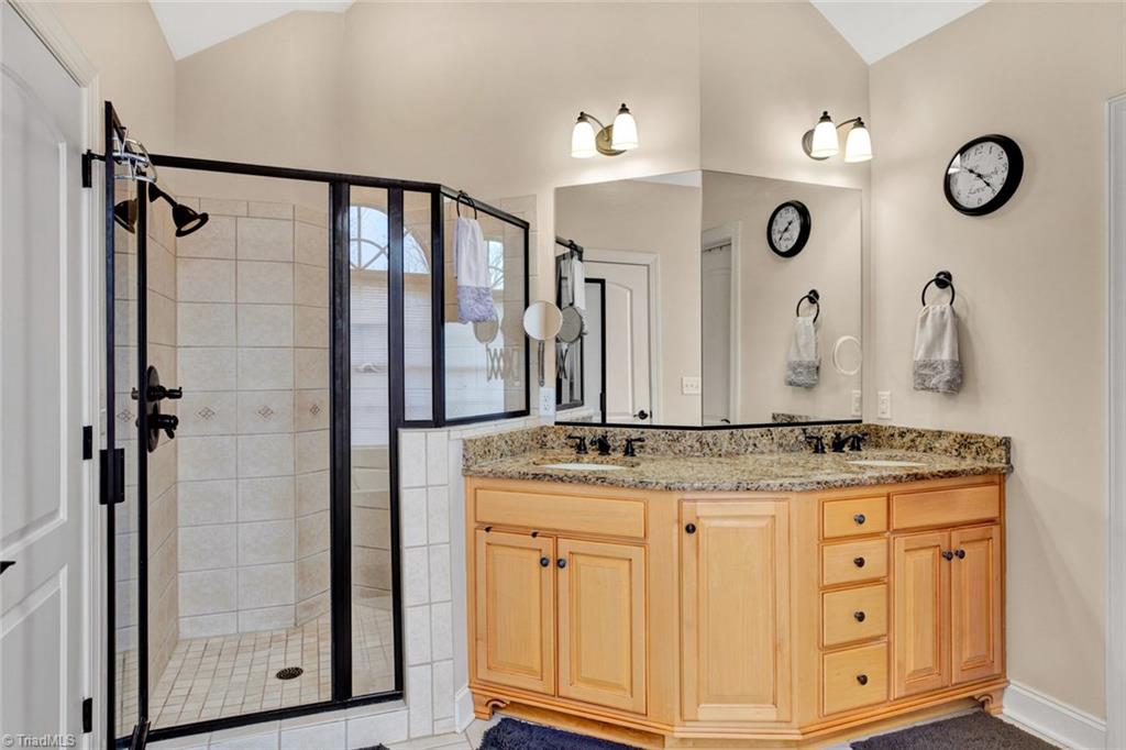 338 Homestead Avenue High Point, NC 27262 - Photo 18 of 25 large master bathroom with vaulted ceiling, garden tub, double vanity, separate tile shower, water closet and large walk in closet
