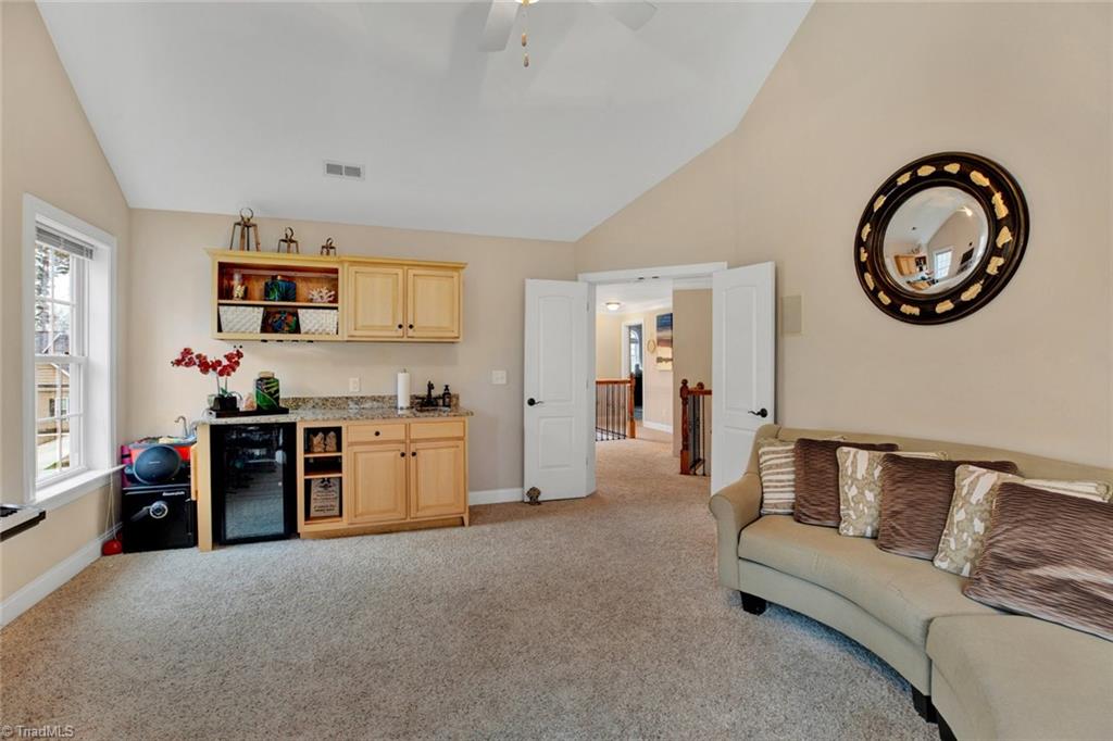 338 Homestead Avenue High Point, NC 27262 - Photo 23 of 25 large bonus room with vaulted ceiling, surround sound, and wet bar