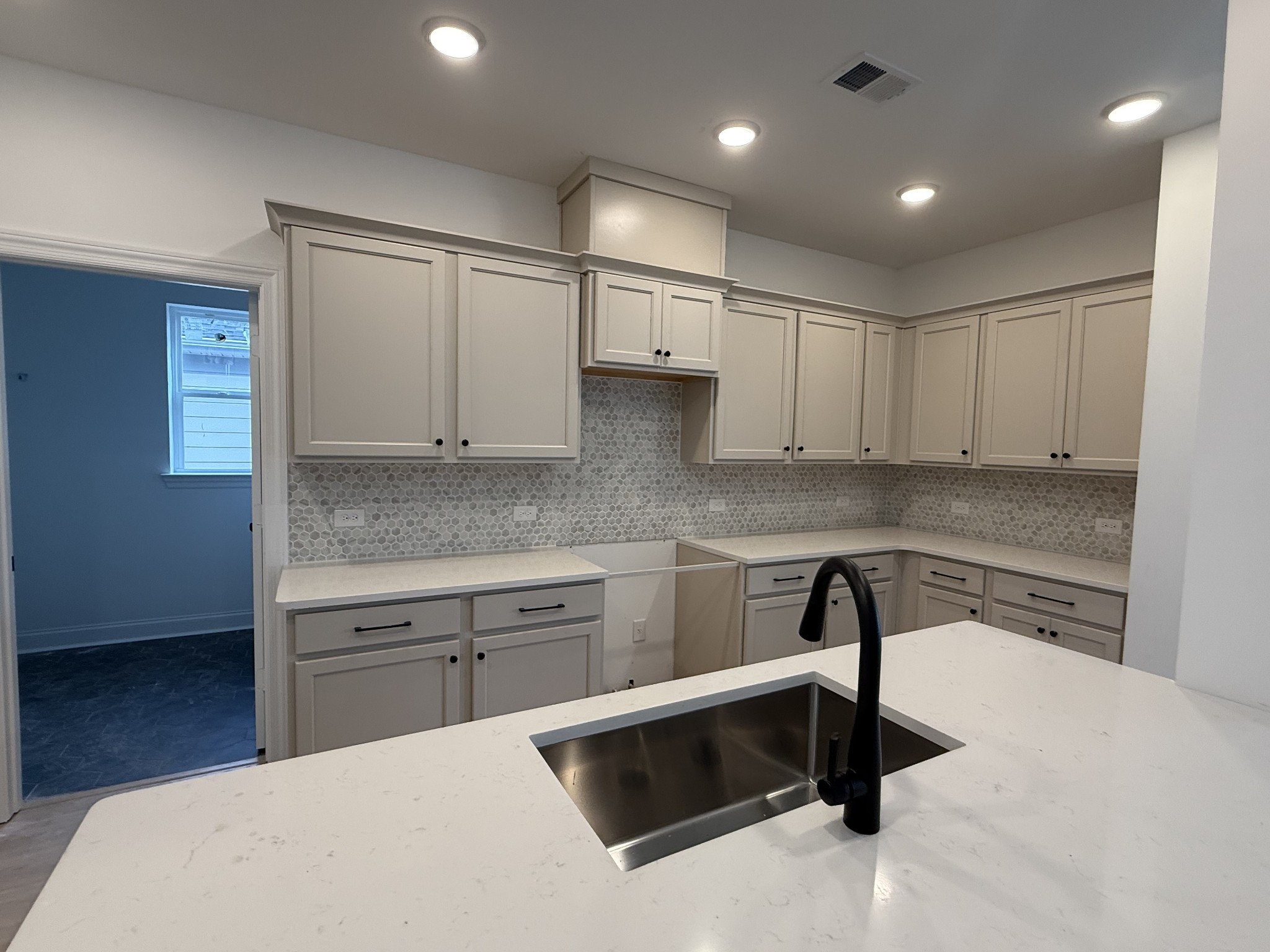 949 Brooklyn Xing Road Gallatin, TN 37066 - Photo 5 of 18 a kitchen with kitchen island a sink stainless steel appliances and cabinets