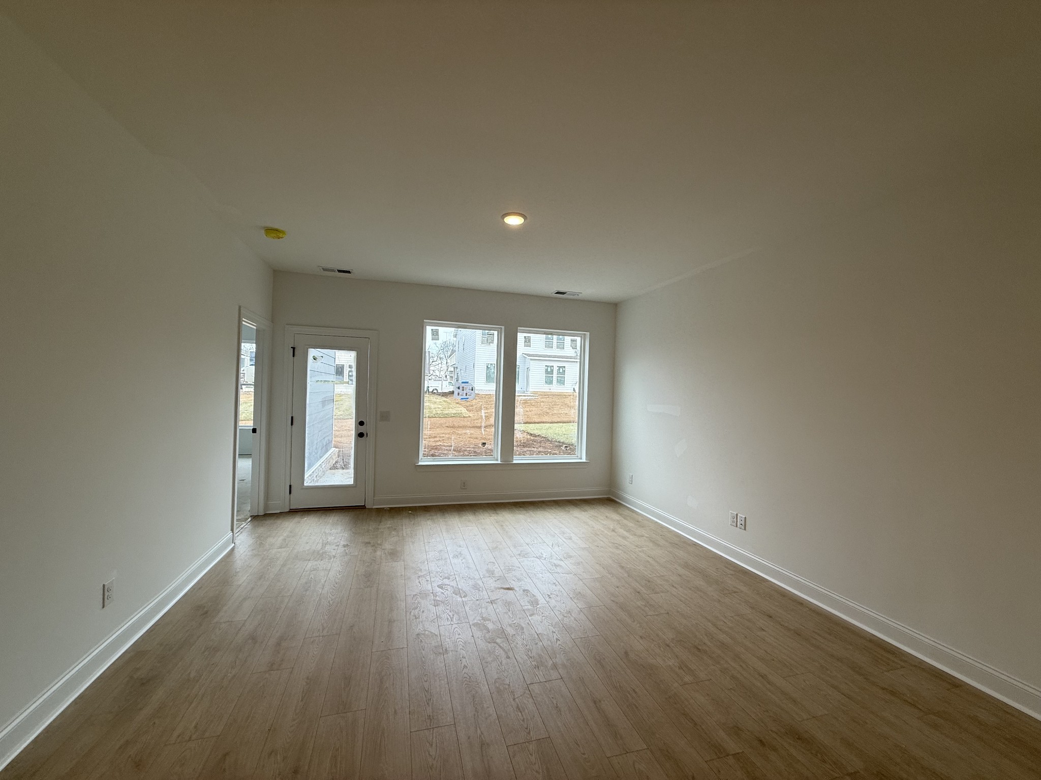 949 Brooklyn Xing Road Gallatin, TN 37066 - Photo 8 of 18 a view of a room that has wooden floor and windows in a room