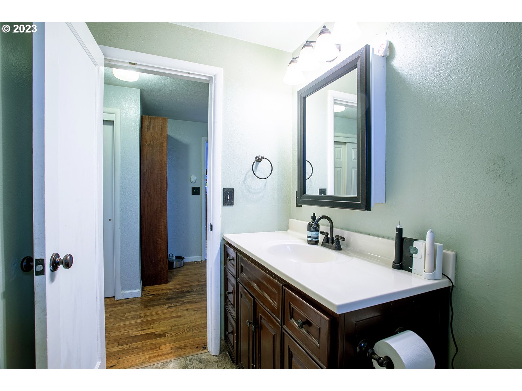 4460 Aster Street Springfield, OR 97478 - Photo 12 of 23 a bathroom with a sink vanity and a mirror
