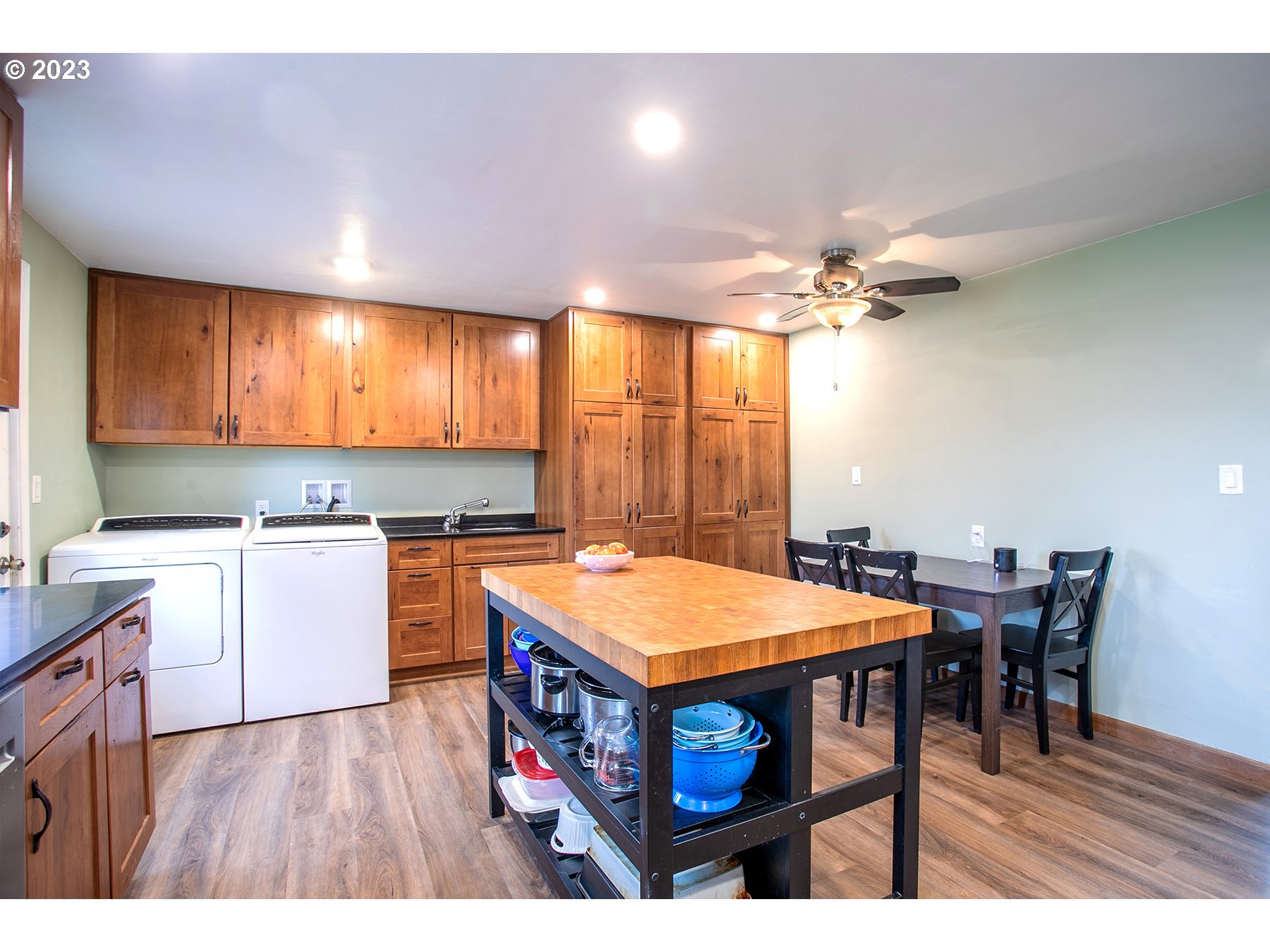 4460 Aster Street Springfield, OR 97478 - Photo 8 of 23 a open kitchen with a table chairs and a stove